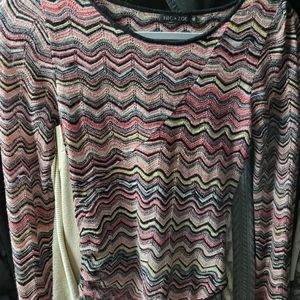 A colorful light shirt with high low hem.  The low is in back.